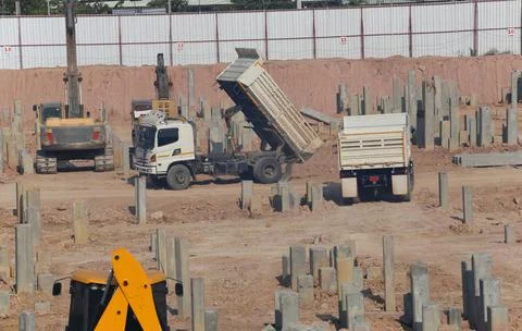 Construction Site with Dump Trucks and Heavy Machinery Stock-Fotos