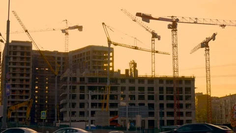 Construction site. During the sunset. Work of tower cranes Stock Footage 75389982