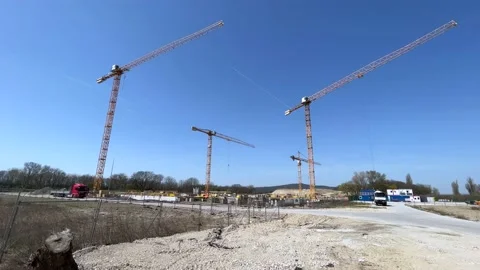 Construction Site Early Stage With three Cranes Sunny 4k Stock Footage 180036031