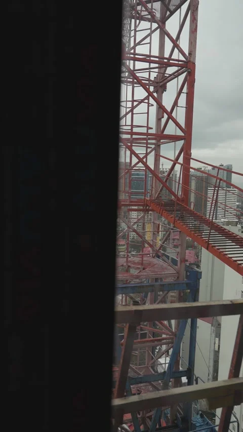 Construction site elevator descending with batumi cityscape view Stock Footage 333501147