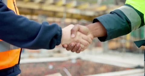 Construction site, engineer and handshake with people outdoor for development Stock Footage 337625741