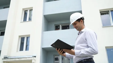 Construction site engineer with tablet checking building technology process. Stockbeeldmateriaal 91830606