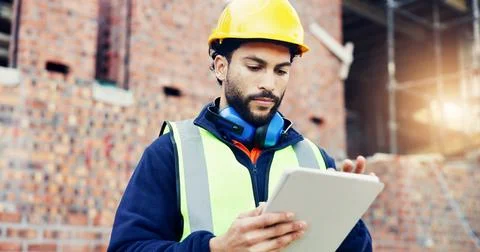 Construction site, engineering and man with internet, tablet for online sch.. Stock Photos