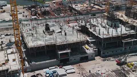 Construction site with equipment. Construction of a large complex using cranes. Stock-Footage 297023219