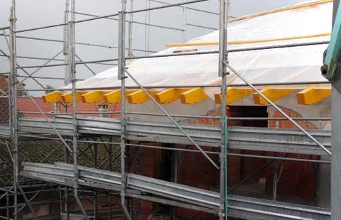 Construction site erect scaffolding Stock Photos