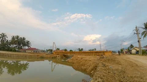 Construction site in the evening with blue sky and white clouds. Stock Photos
