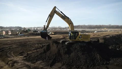 Construction Site Excavator Digs Up Dirt While Working Stock Footage 145377860
