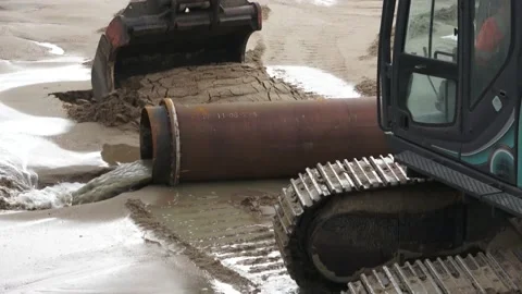 Construction Site Excavator Working With Pipeline On The Beach Near Ocean Stock Footage 150384168