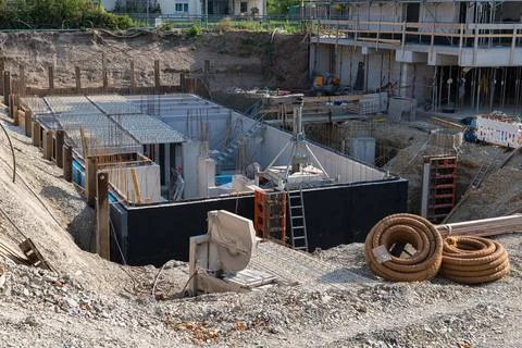 Construction site featuring a building foundation in progress Stock Photos
