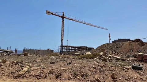 Construction Site Featuring a Crane and Active Building Progress Taking Place Stock Photos