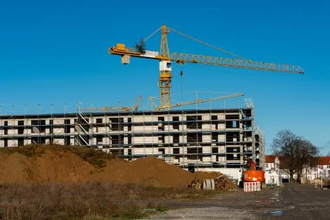 Construction site featuring crane at new residential building project Stock Photos