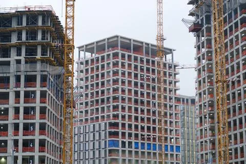 Construction site featuring multiple high-rise buildings under development with Stock Photos