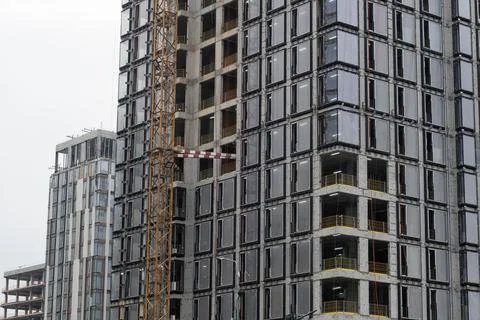 Construction site featuring two high-rise buildings under development with .. Stock Photos