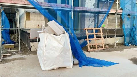 Construction Site Featuring Various Materials, Equipment, and Essential Saf.. Stock Photos