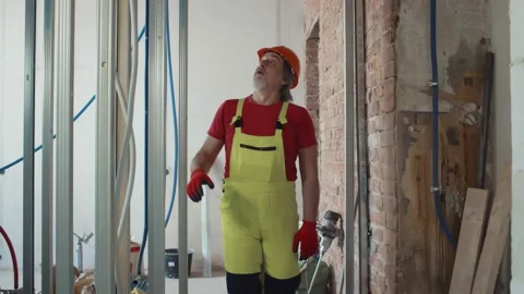 Construction site foreman supervising process of apartment renovation Stock Footage 133639533