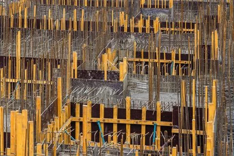 Construction site with formwork and rebar in progress outdoors, full-frame 写真素材