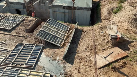 Construction Site Foundation Work With Concrete Formwork Panels And Soil Stock Footage 317251146