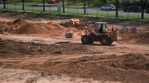 Construction site, front loader working at the construction site Stock Footage 241943688