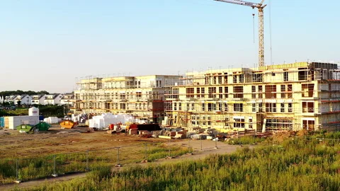 Construction site of a future modern apartment building in shell constructi.. Stock Footage 274428044