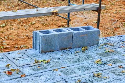 Construction site with gray concrete blocks on a partially completed floor Stock Photos