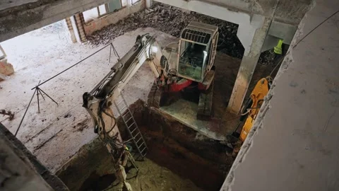 Construction site, a group of workers in helmets work with heavy drilling Stock Footage 263773046