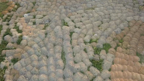 Construction site with heaps of sand and land on a summer evening at sunset Stock Footage 110942454