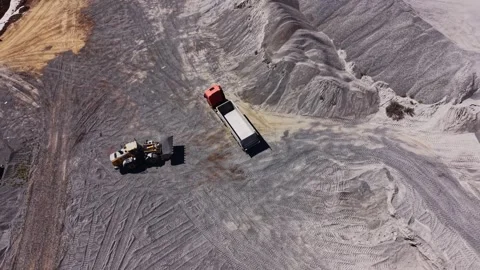 Construction site with heavy machinery and materials on ground Stock Footage 344538678