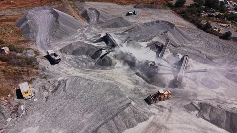 Construction site with heavy machinery and materials in use Stock Footage 344538989