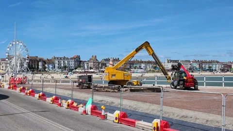 Construction site with heavy machinery working on coastal defences Stock Footage 340170198