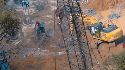 Construction site with heavy machinery - a yellow excavator and crawler crane Stock Footage 340626380