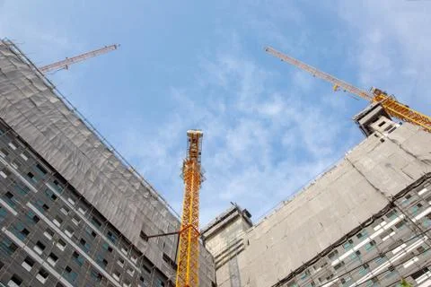 Construction site high building tower with crane Stock Photos
