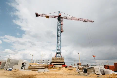 Construction site with high cranes. Construction of modern apartment building Stock Photos