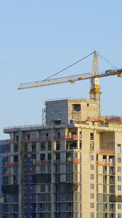Construction site with high-rise building under construction. Building partially Video stock 293851654