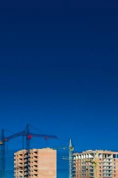 Construction site. High-rise multi-storey buildings under construction. Tower Stock Photos