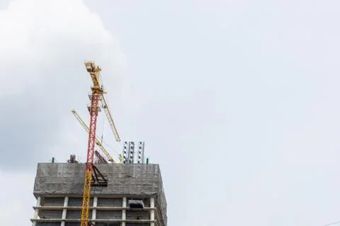 Construction site hoisting cranes Stock Photos