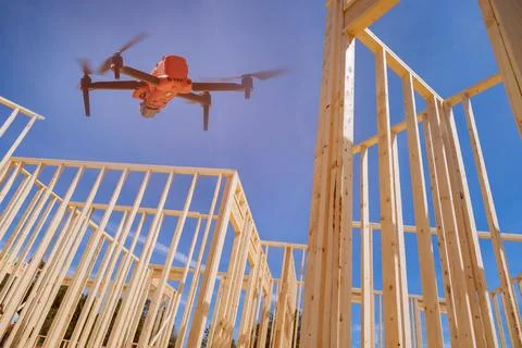 On the construction site, the inspector with the help of drone checks the Stock Photos