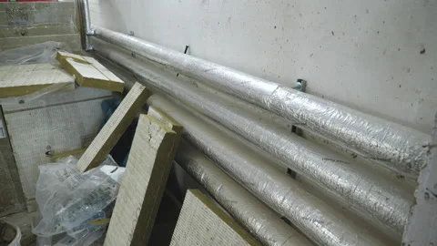 Construction site - insulation of steam pipes 库存影片 247564171