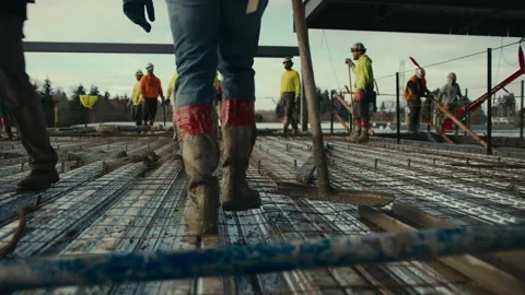 Construction Site: Laborer walks through site Vidéo 224949475