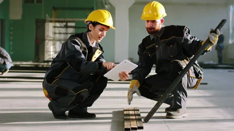 Construction site with large space building construction man and woman worker Stock Footage 170143528