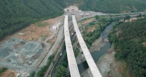 A construction site with a large tunnel being built at new highway, aerial sh Video stock 347175962