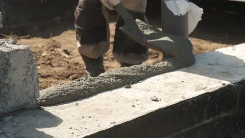 Construction site. Laying of slabs, bricks, concrete mortar. Stock Footage 167590754