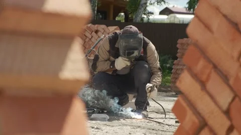 Construction site. Laying of slabs, bricks, concrete mortar. Stock Footage 167590811