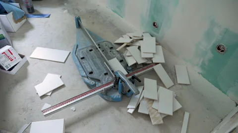 Construction site - laying tiles, tile cutting machine Видео 249265078