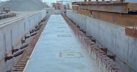 Construction site, a long concrete beam lies in the form. Poured concrete Stock Footage 158406278