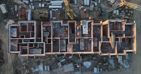 Construction site of low-rise brick houses in summer. Aerial view Stock Footage 235458728
