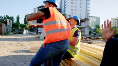 Construction site at lunch time Afro American came to his team and start dancing 스톡 동영상 148227161