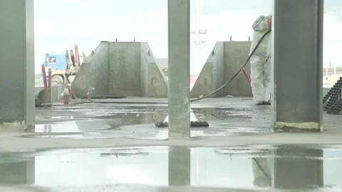 Construction site, man in a white suit at work Stock Footage 285138205