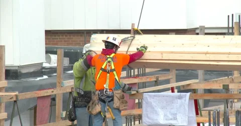 Construction Site - materials lowered by crane - 4k Stock Footage 60405346