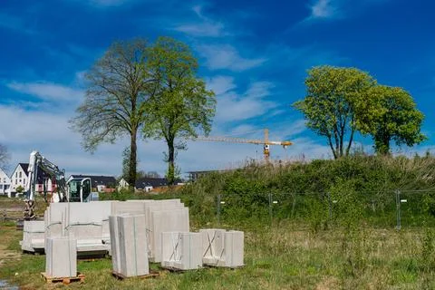 Construction site with materials under blue sky in springtime Stock Photos