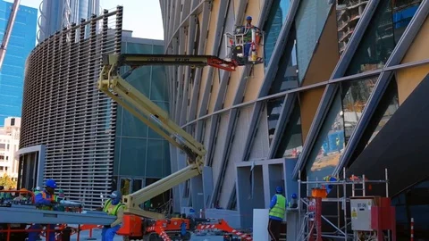 Construction site, men, tools, crane and building under construction Stock Footage 108742734